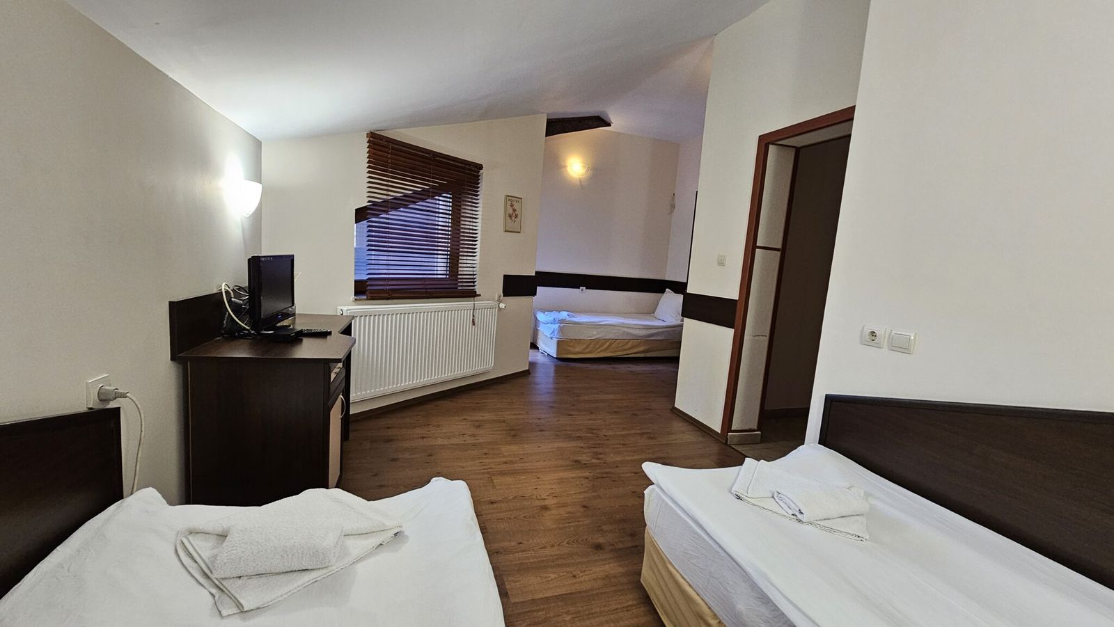 A triple room, seen from the door